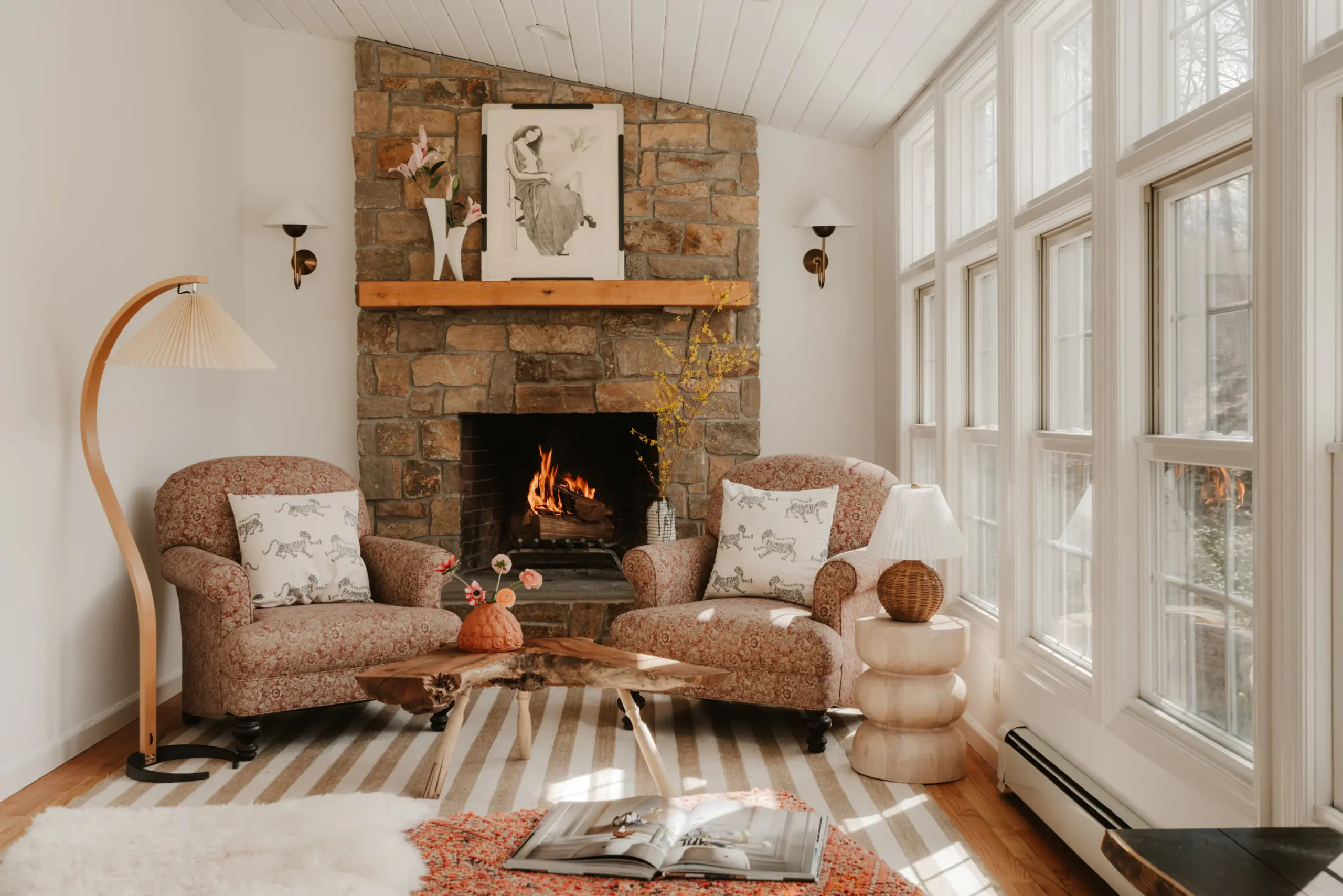 Cozy living room with a stone fireplace, used to illustrate fireplace due diligence for Cherokee and Cobb County home buyers