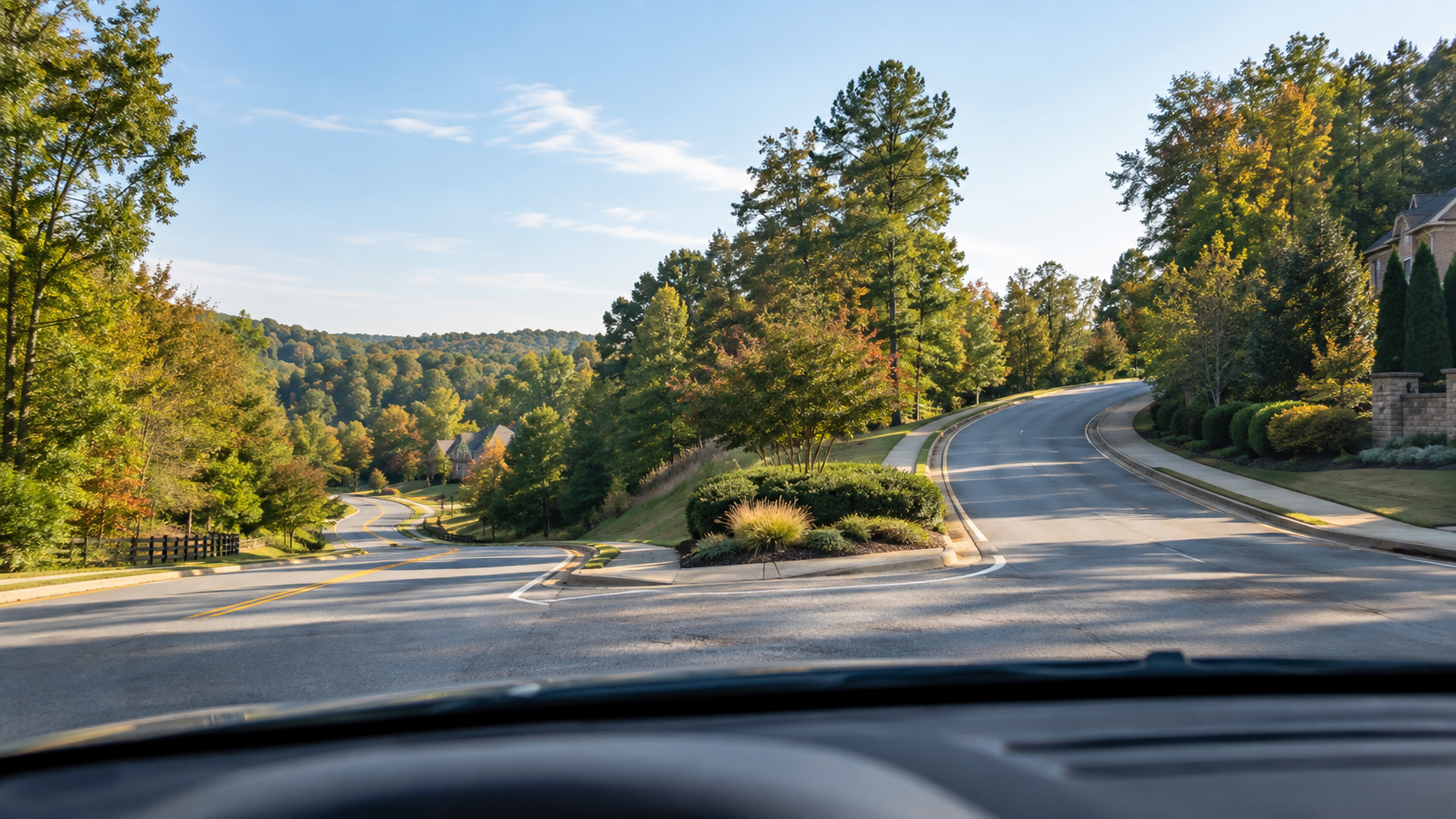A branching suburban road in North Georgia, representing the need to test more than one daily route before choosing a home.